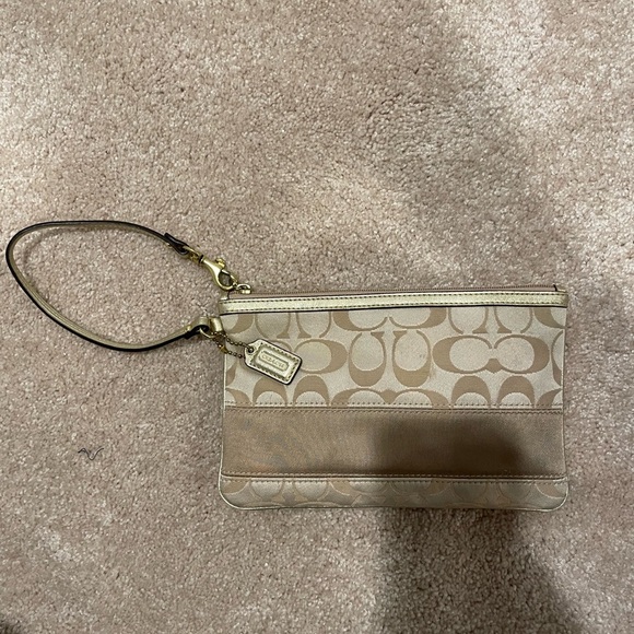 Coach Handbags - COACH Oversized Gold Wristlet